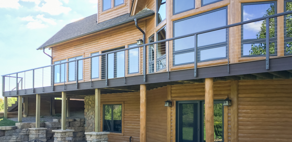 Considering Cable Railing to maximize your beautiful backyard view? Here's what Michigan homeowners should know, including styles, maintenance, building code, and which brands we trust.