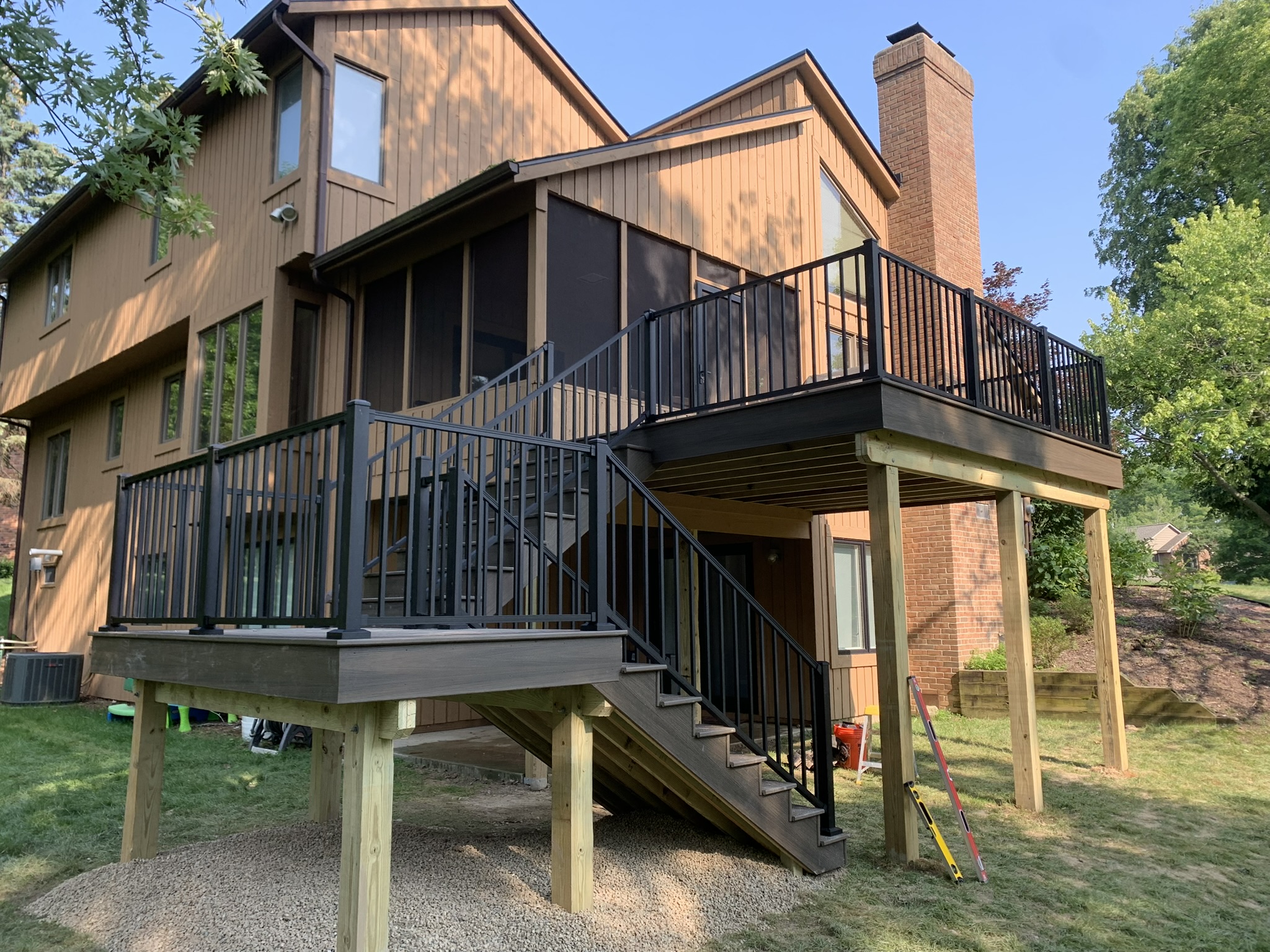 Trex Enhanced Deck Landing Signature Rail Trex deck builder in Ann Arbor MI with black railing