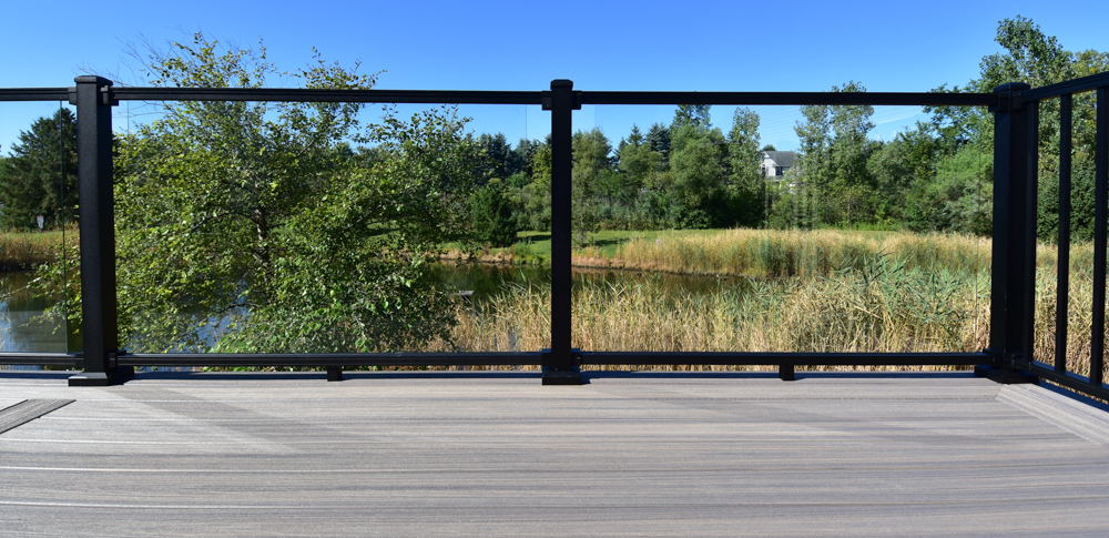Glass railing turns an ordinary deck into something spectacular, but Michigan homeowners need to think through heat, airflow, maintenance, and hardware before committing. Let's look at what's involved with glass rails.